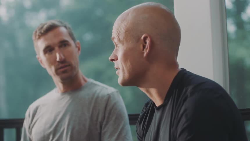 Two men sitting talking