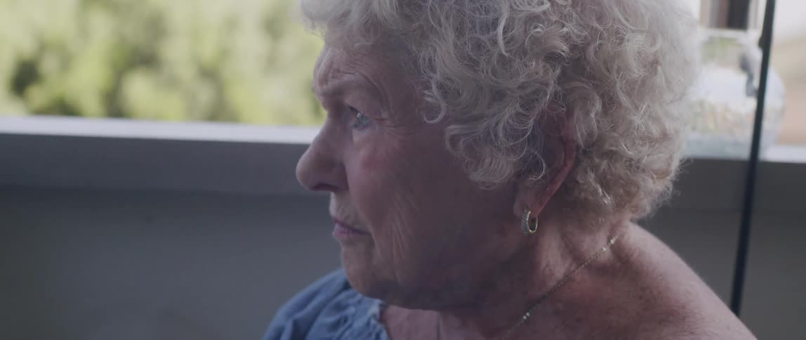 Side portrait of a seated elderly lady