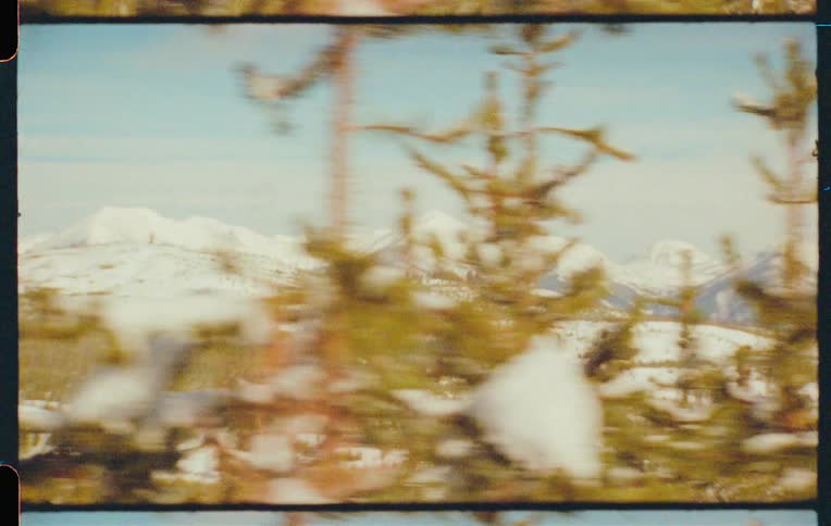 A snowy mountain landscape captured on vintage film