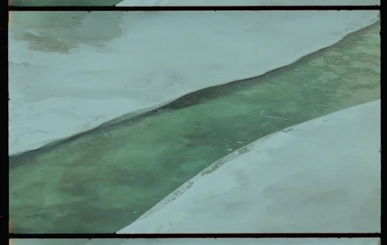 River flowing on ice covered ground