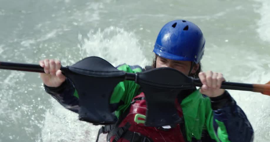 Kayaker maneuvering through some rough waters