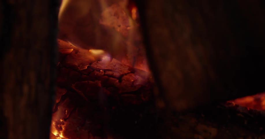 A campfire flames and burns