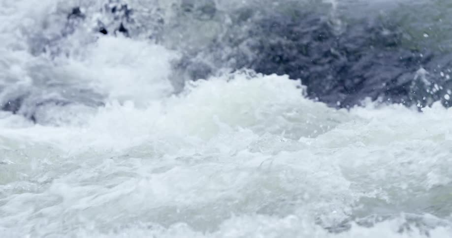 Water splashes and streams fast around