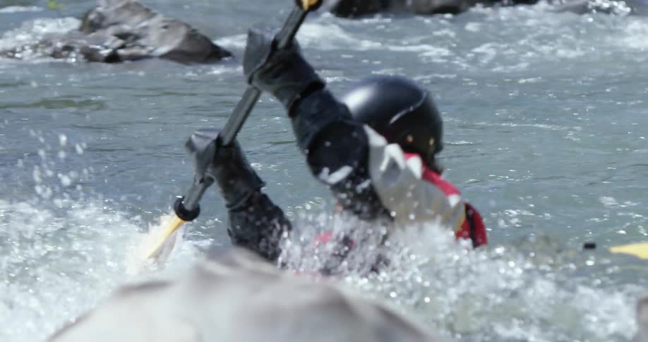 Kayaker maneuvering through some rough waters