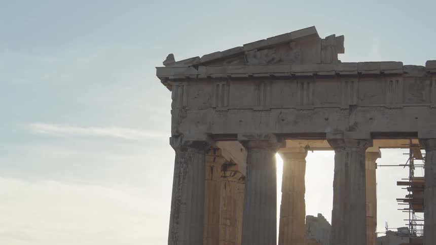 Exterior architecture of a monument with greek columns and ancient