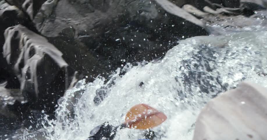 Kayaker maneuvering through some rough waters