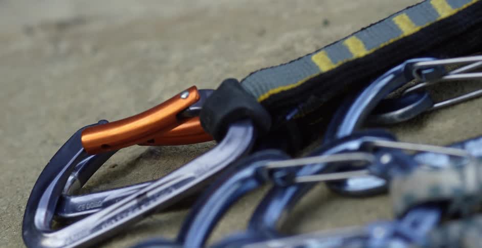Carabiners and straps lying on the rock as seen close-up