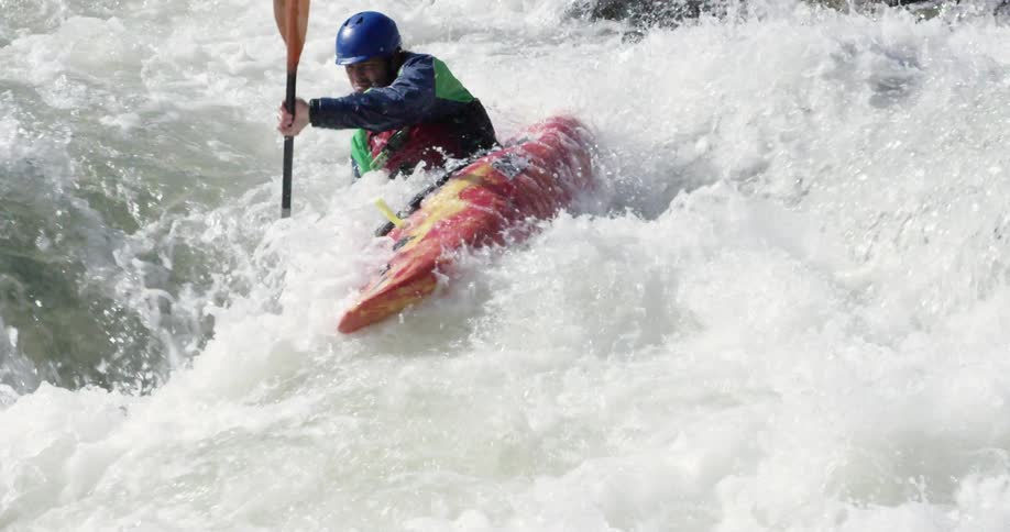Kayaker maneuvering through some rough waters
