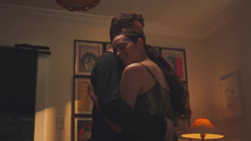 Couple in a room of the house dancing romantically