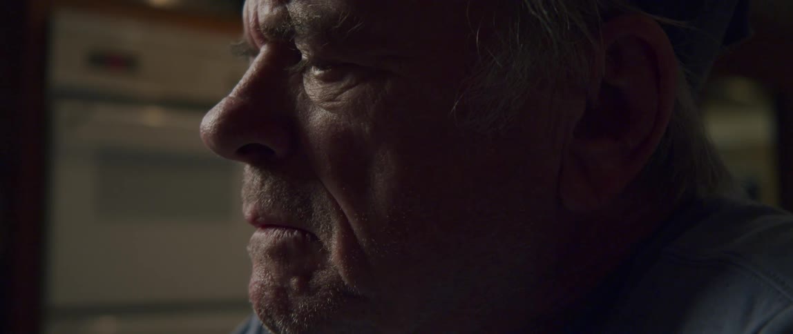 Side portrait of a thoughtful elderly man