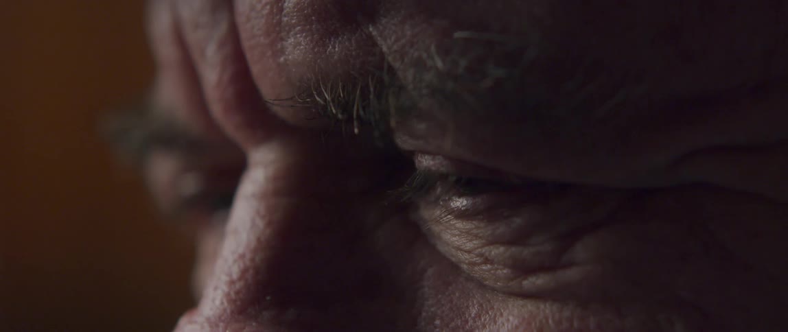 Closeup of the eyes of an emotional elderly man