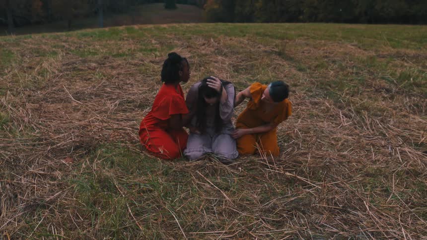 Three women in a melancholic dance performance