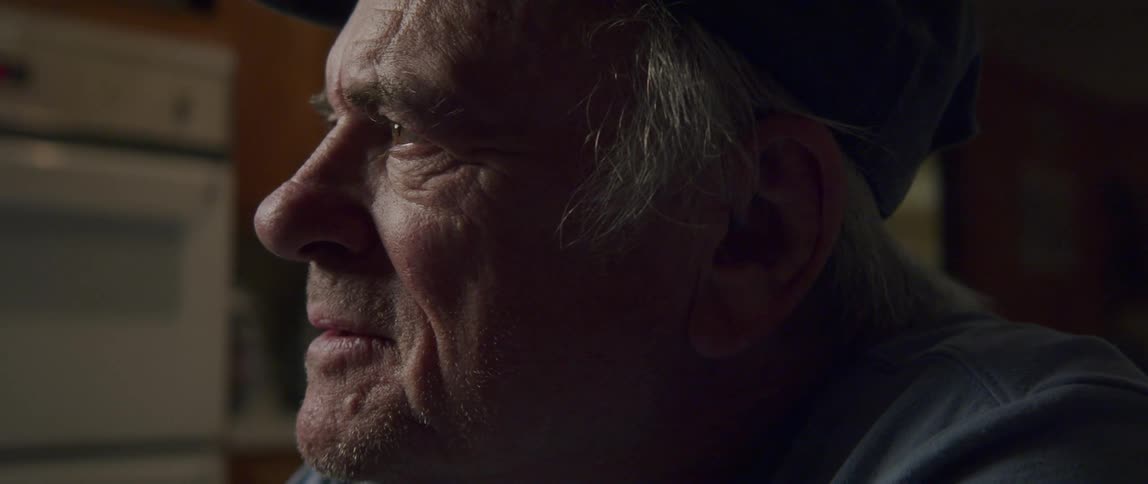 An elderly man with an expression of thoughtfulness on his face