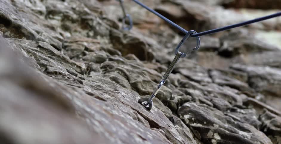 Rope running through anchored carabiners