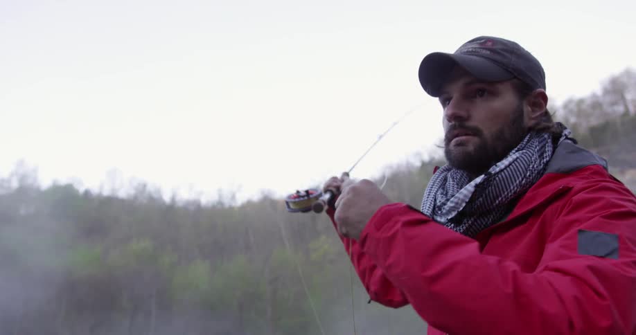 A man is casting a fishing rod