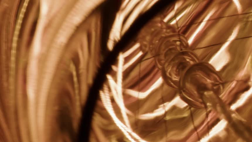 Lines circling around the center of a bulb glow as the light shines