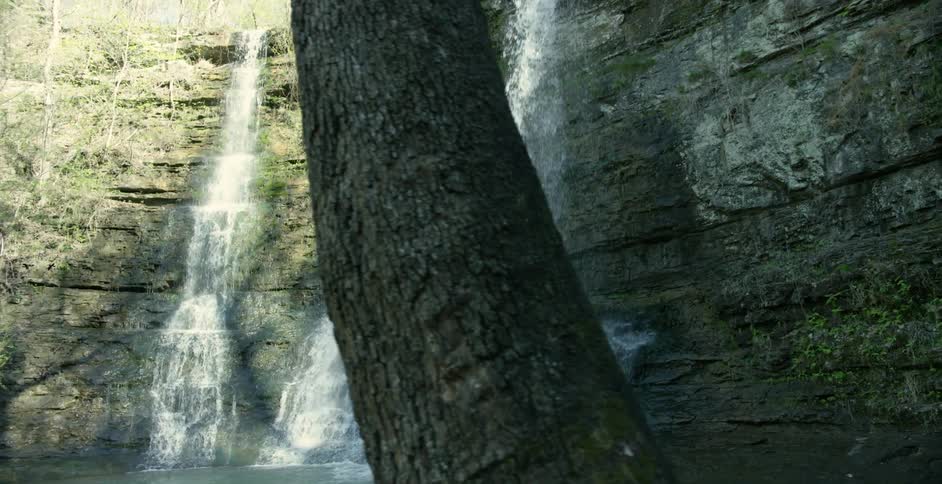 A waterfall falling from a high cliff