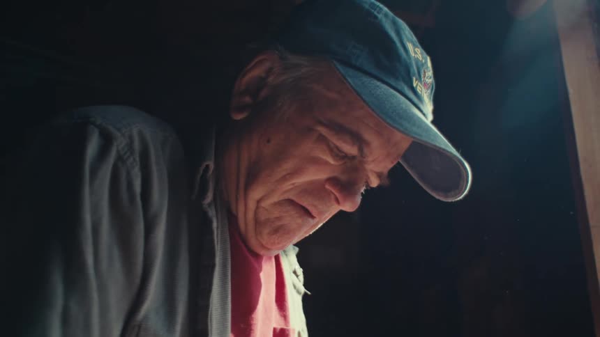 A clip of an elderly man taking a measurement