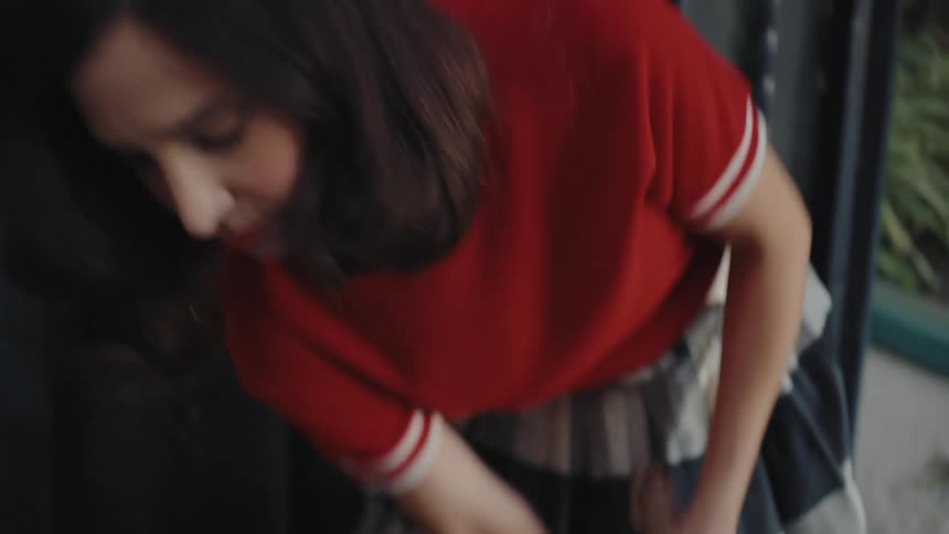 Woman with a broom sweeping the floor