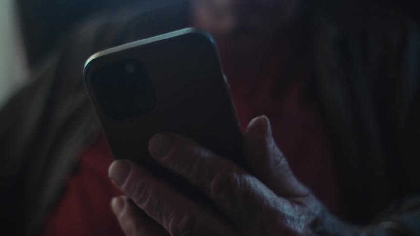 A man is using his cell phone