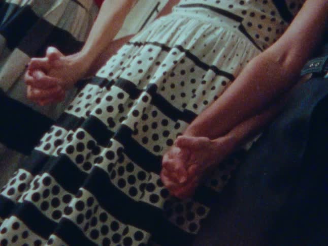 Three women holding hands together