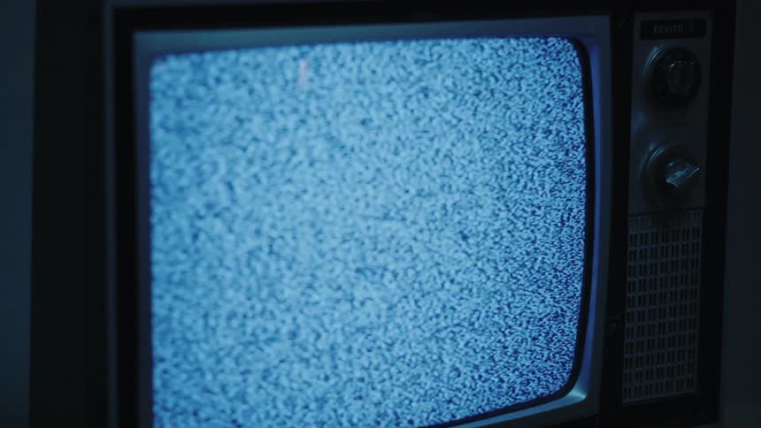 Close up of an old television with no signal