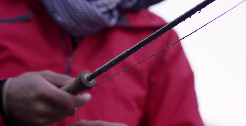 Close up of a man holding his fishing rod