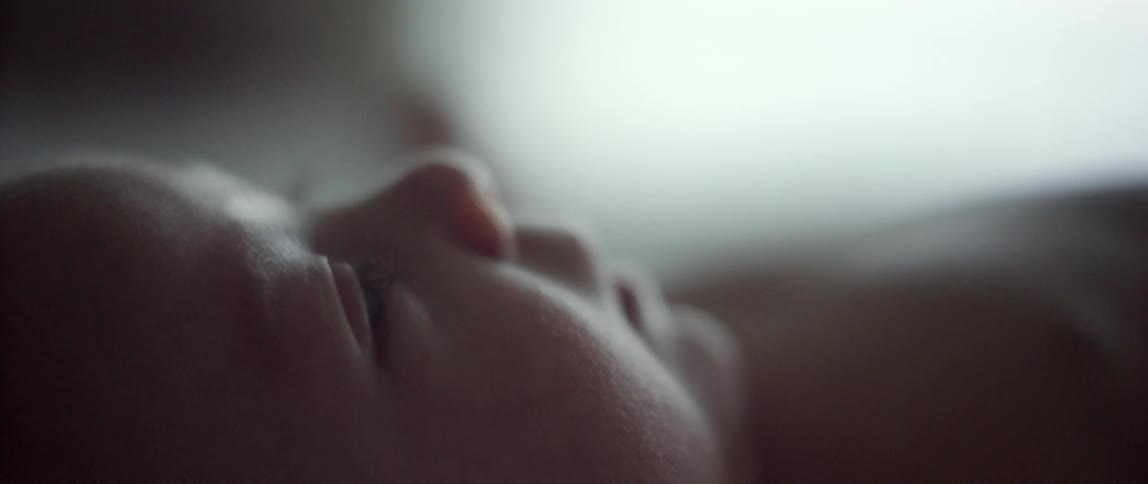 Baby laying down looking up