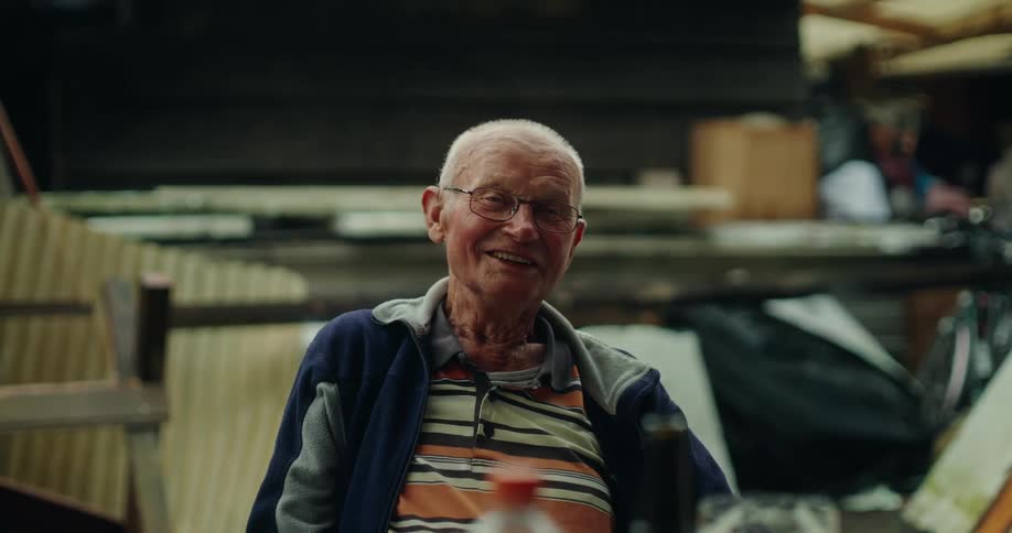 Elderly man sitting talking