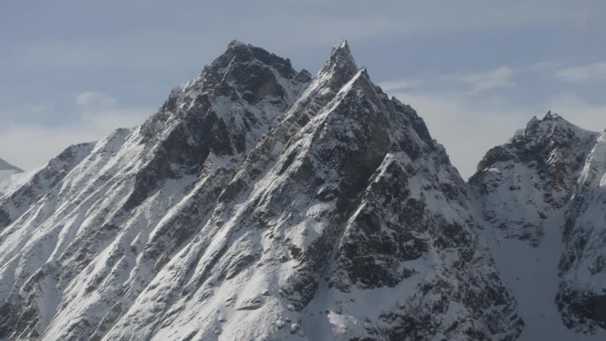 The mountain top is covered with snow