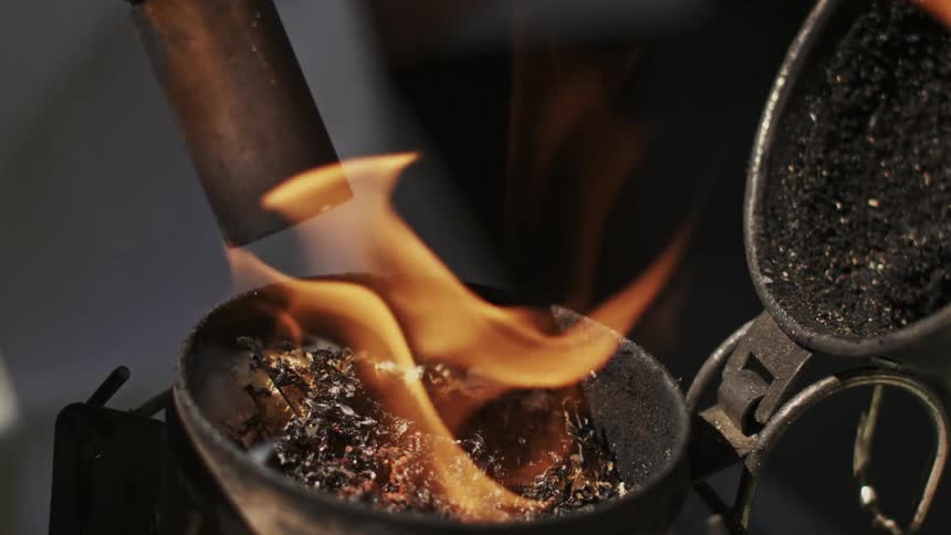 A metal device contains burning material