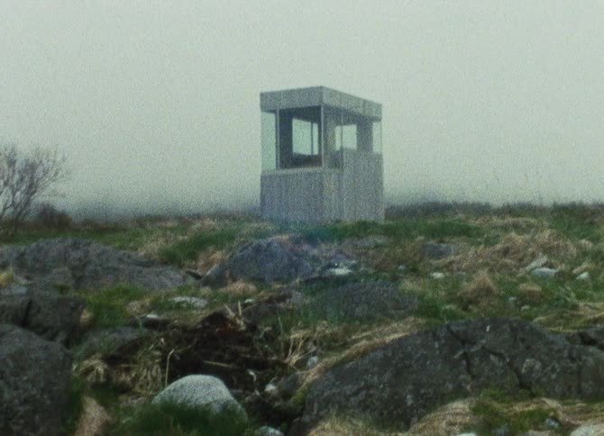 A clip of a building out in the woods