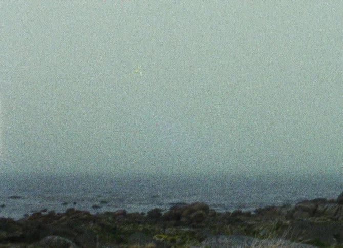 Ocean waves flow to a rocky coastal area