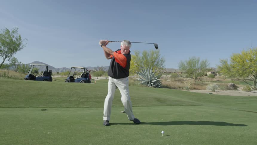 A golfer hitting a golf ball