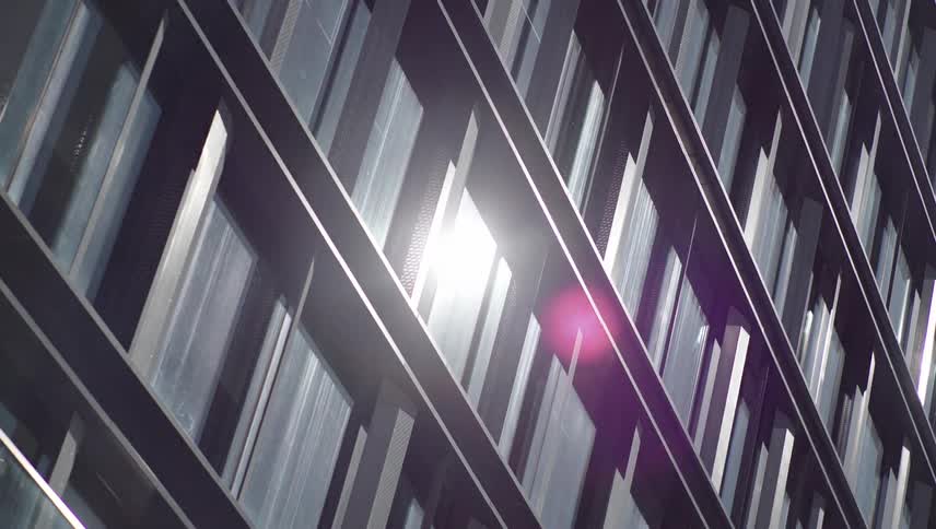 The sun is reflecting on the windows of the building