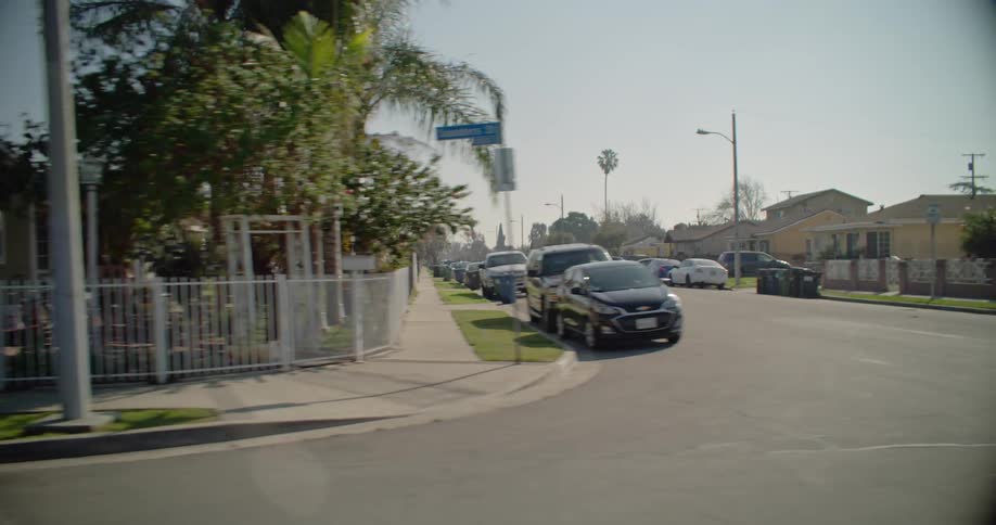 Cars are parked all over the roads in this neighborhood