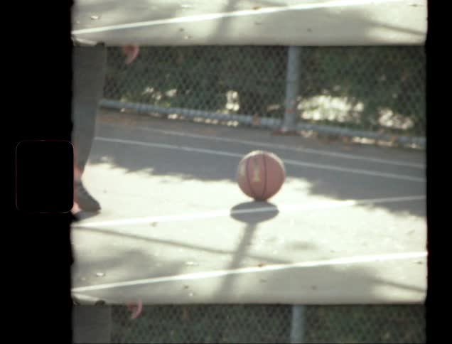The basketball rolls over to the person