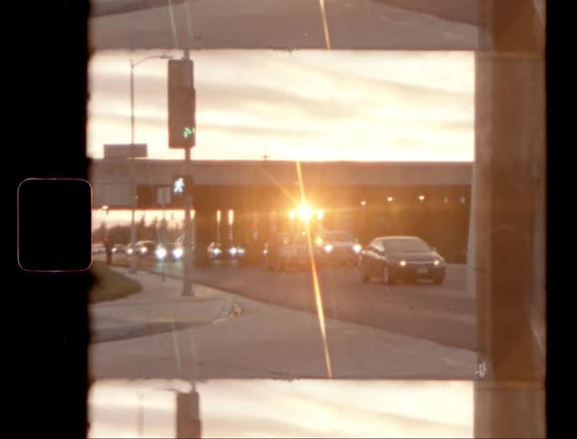 Traffic flows on the road at sunset