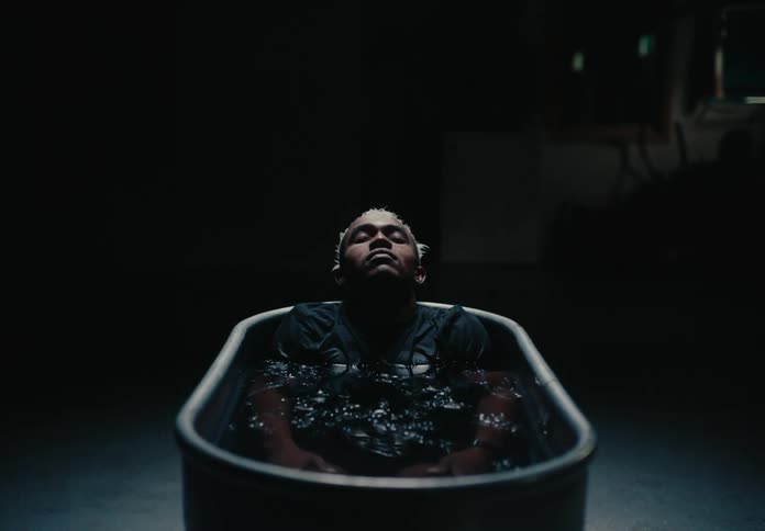 Man lying in an ice bath