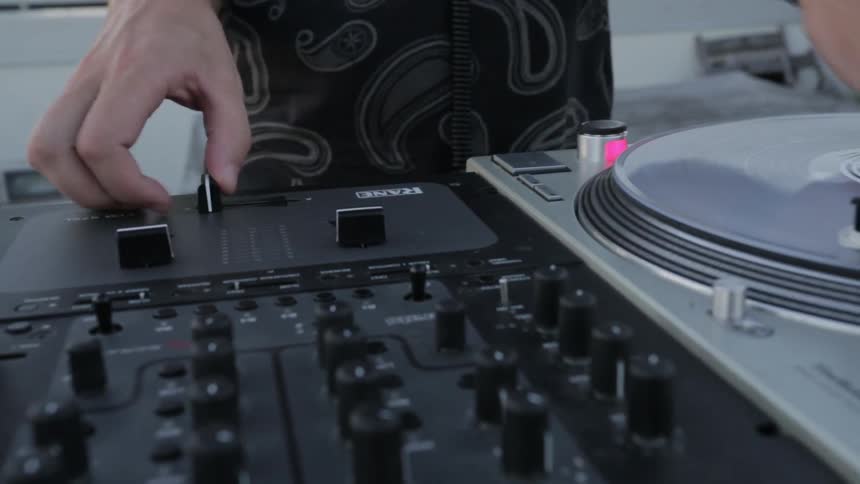 DJ spinning record on turntable