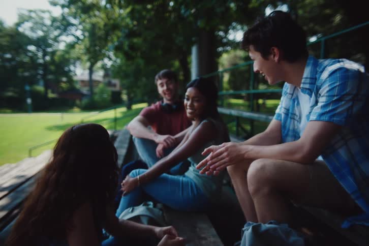 Friends talk together in the park