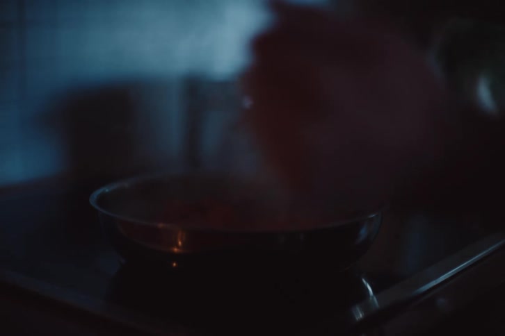Steam rises from the cooking food