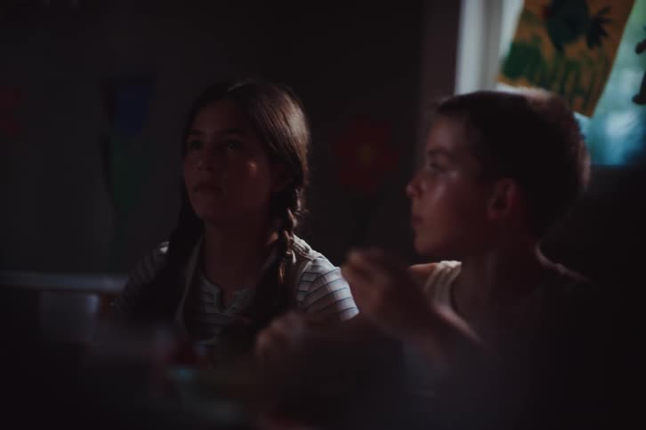 Children are eating inside together