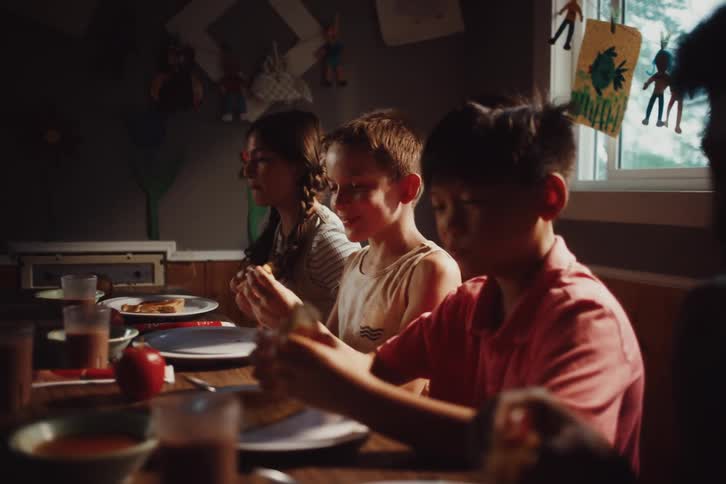 Children sitting at the table eating