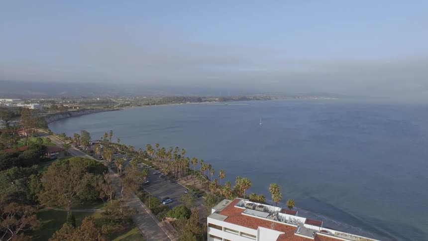 Aerial view of a large body of water on a curved coastline