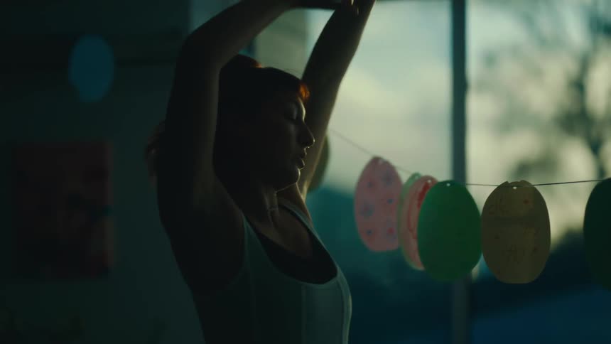 Short haired redhead woman dancing