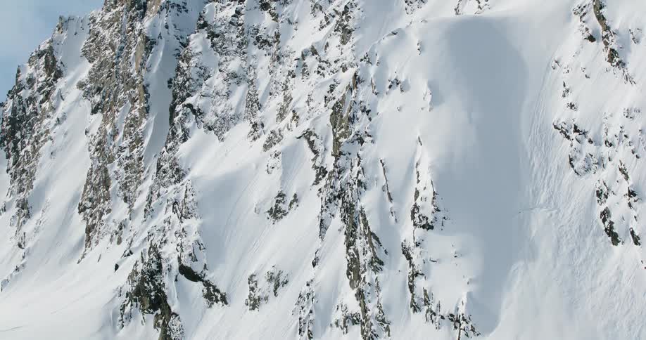 Wall of a mountain covered in snow