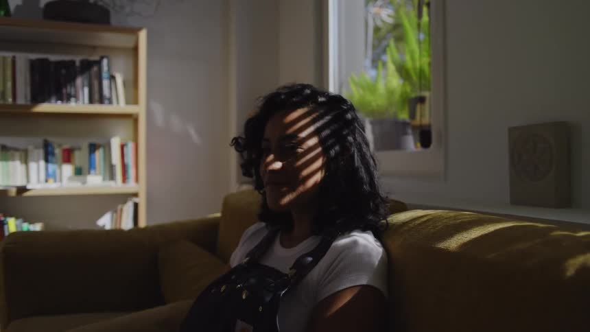 Woman sitting on a couch talking