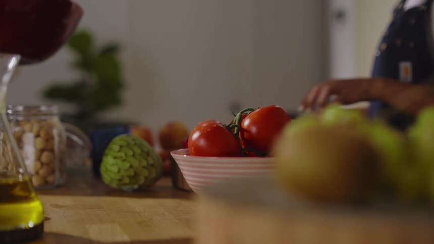 Two women are preparing food together