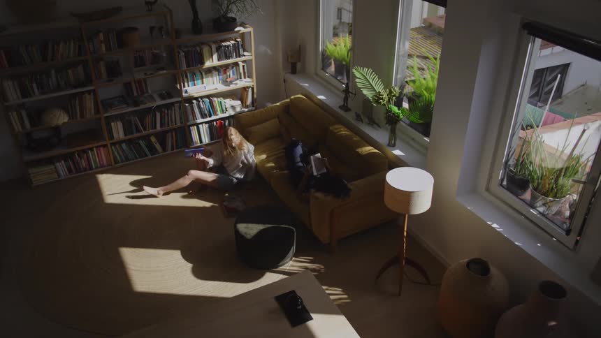 Two women read books at home